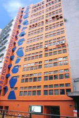ROOM+ big orange and blue mini storage building